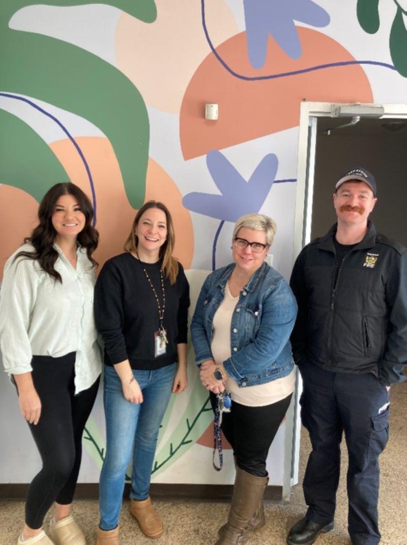 Representatives of the Crocus Cooperative in Saskatoon stand with members of the Saskatoon Overdose Outreach Team.