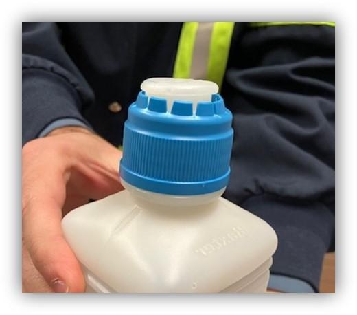 Baxter Pour Bottle - Damaged Cap from Improper Opening Technique