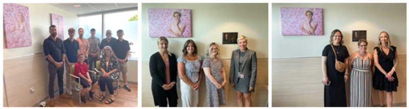Family of the donator, SHA staff, and the models from the art stand in front of it in the Regina Breast Health Centre